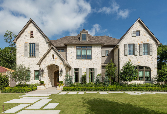 Stone home. Stone home ideas. The exterior of this home features beautiful natural stone and grey shutters. #stonehomes #stoneexterior #greyshutters Allan Edwards Builder Inc 