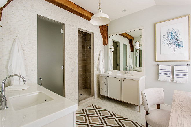Transitional bathroom. There's nothing boring about this bathroom. I love the barn pendant light, the beam accent and the floor tile. #transitionalbathroom #bathroom #tile #barnpendantlight #light #beam Herlong & Associates Architects + Interiors