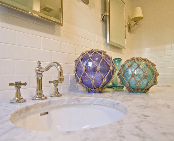 Glass Buoys. Glass buoys add some color and a coastal feel to this guest bathroom. Glass Buoys. vanity-decor Glass Buoys #GlassBuoys Home Bunch Beautiful Homes of Instagram Bryan Shap @realbryansharp