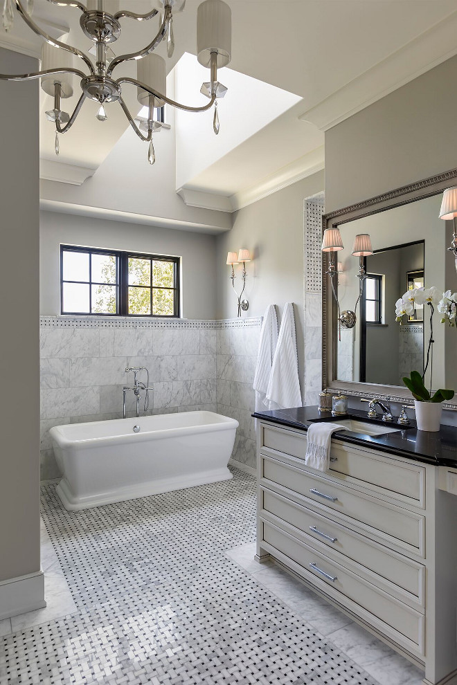 French Bathroom. This elegant French grey bathroom features custom vanity with soapstone countertop and marble basketweave floor tiles. #Frenchbathroom #Frenchinteriors #bathroom Hendel Homes