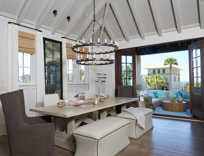 Dining room. Open to outdoors dining room. A wall of bifold doors connects the indoors to the outdoors, allowing plenty of ocean breeze in. #dininroom #opnediningroom #biforlddoors dining-room