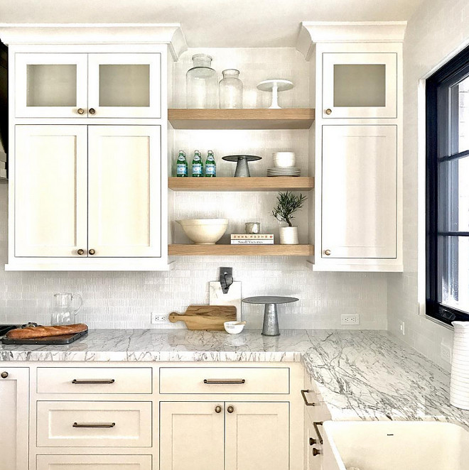 Rift sawn Shelves. White Farmhouse kitchen with Rift sawn oak shelves between cabinets. Farmhouse kitchen with Rift sawn oak shelves between cabinets. Backsplash is from Ann Sacks. #WhiteFarmhousekitchen #openshelves #Riftsawn #Riftsawnoak #Riftsawnoakshelves Caitlin Creer Interiors