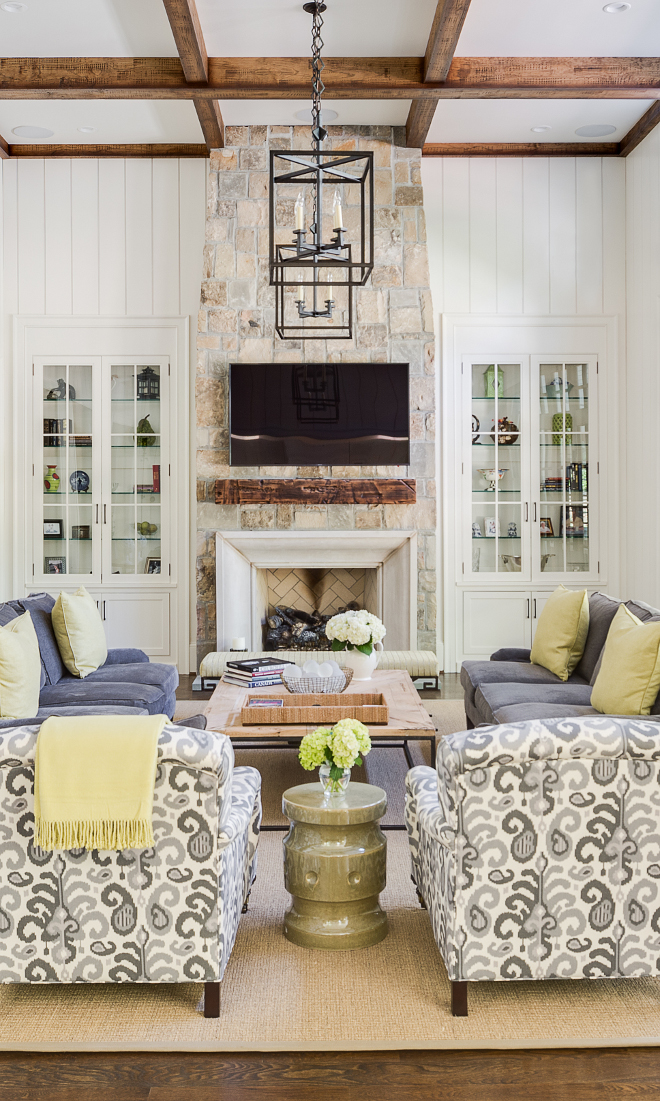 Stone Fireplace. The fireplace uses the same stone as used on the exterior of the house with a limestone surround. Stone fireplace #StoneFireplace Interiors by Courtney Dickey. Architecture by T.S. Adam Studio. 