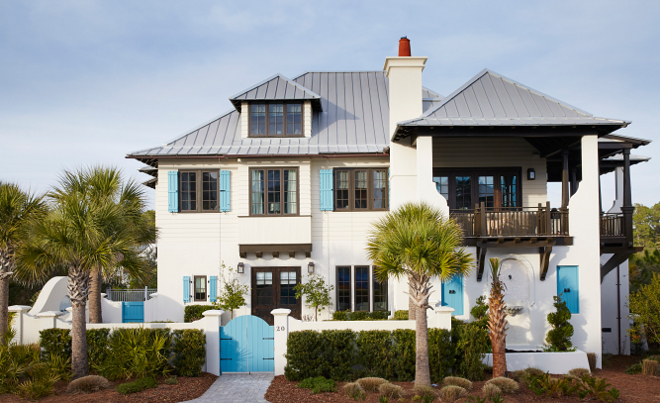 Floida beach house. The exterior of the house mixes traditional West Indies with coastal architectural details. Dark steel windows paint color is Espresso Beans PPU5-01 Behr. florida-beach-house