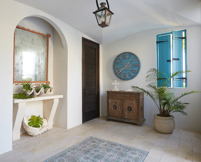 Outdoor foyer. Beach house with outdoor foyer. The outdoor foyer features an antique mirror and a built-in cast-concrete console. #outdoorfoyer #foyer