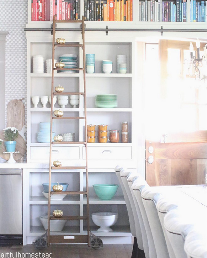 Kitchen ladder. The sun filtering thru the dutch door mixed with the crisp air is as perfect as it gets! Freshly preserved jars and little gold leaf pumpkins are some signs in my home that fall has arrived. Kitchen library ladder. Library Ladder: Alaco.kitchen-ladder #kitchenladder #kitchen #ladder #libraryladder #cabinet Home Bunch's Beautiful Homes of Instagram @artfulhomestead