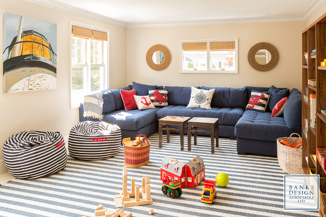 Nautical themed rooms. Located above the garage, this nautical playroom features classic coastal colors like navy, red and stripes. #nauticalthemed Banks Design Associates, LTD & Simply Home