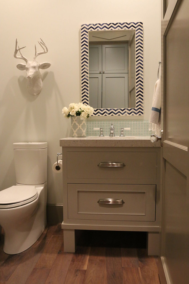 Small vanity. This small bathroom features hardwood flooring, a small vanity and a quartz countertop. small-vanity #smallbathroom #smallvanity #smallspaces Home Bunch's Beautiful Homes of Instagram @artfulhomestead