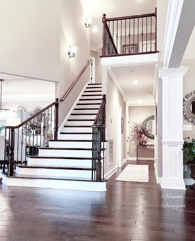 Traditional staircase. Paint color is Sherwin Williams Perfect Greige. The front doors open to a large foyer with an elegant traditional staircase. #traditionalstaircase #staircase traditional-staircase Home Bunch Beautiful Homes of Instagram @blountdesigns
