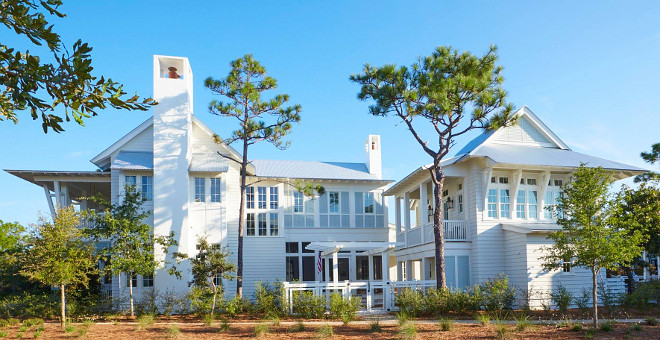  Designed by Geoff Chick & Associates and built by Chris Clark Construction Incorporated, this Florida beach house is full of new coastal design ideas! The architectural details are truly inspiring. Walls are paneled with white shiplap and the ceilings, when not featuring shiplap, are beautifully crafted with coffered trim and pecky cypress wood. Located in 30A, this beach house has a very soothing, relaxing color palette that easily transports you to a sunny summery day. #Beachhouse #beachhouseexterior white-beach-house-exterior Geoff Chick & Associates