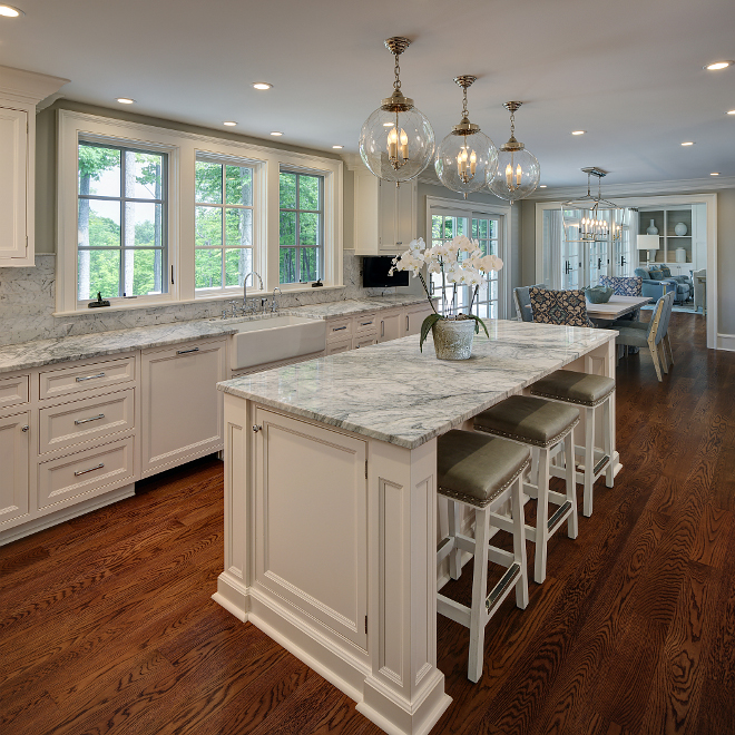 White kitchen countertop. This gorgeous kitchen features white marble countertop and backsplash. Wall paint color is Repose Grey by Sherwin Williams. #White kitchen with white marble countertop. #whitekitchen #whitemarble #countertop #marblecountertop white-kitchen-countertop W Design