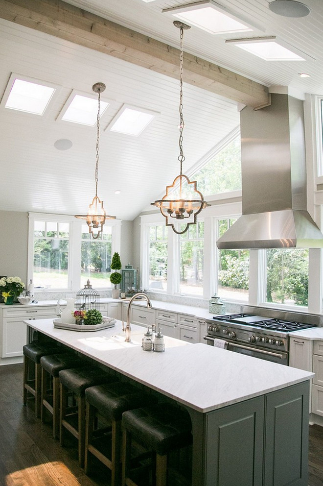 Kitchen vaulted ceiling with beam. The vaulted ceilings are shiplap painted in Sherwin Williams Alabaster. #SherwinWilliamsAlabaster #vaultedceiling #shiplapceiling #beam #ceiling Outrageous Interiorstchen-beamed-ceiling