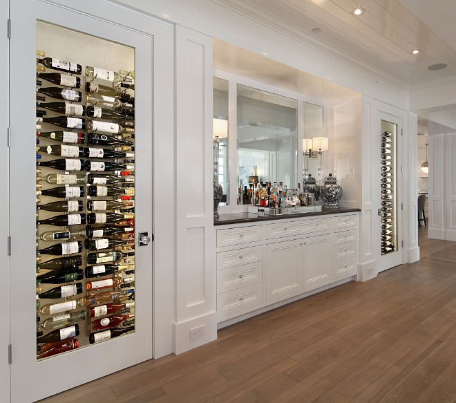 Built in wine cellar. The two temperature controlled wine closets and the built-in buffet were custom designed for this home. Built in wine cellar. Built in wine cellar. Dining room with Built in wine cellar. #Builtinwinecellar #winecellar Brandon Architects, Inc