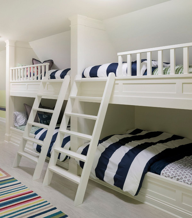 Bunk beds. The custom built bunk beds feature wide ladders. Notice the classic millwork. Paint color is "Benjamin Moore OC-17 White Dove". #bunkbeds Stonewood LLC. Studio M Interiors. Spacecrafting Photography