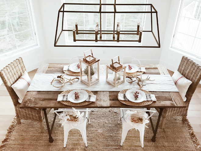 Farmhouse Dining Room. Farmhouse Dining Room with linear chandelier, rustic dining table, sisal rug and wicker chairs. #Farmhouse #DiningRoom #FarmhouseDiningRoom #linearchandelier #rusticdiningtable #sisalrug #wickerchairs Instagram Beautiful Homes of Instagram @NC_HomeDesign