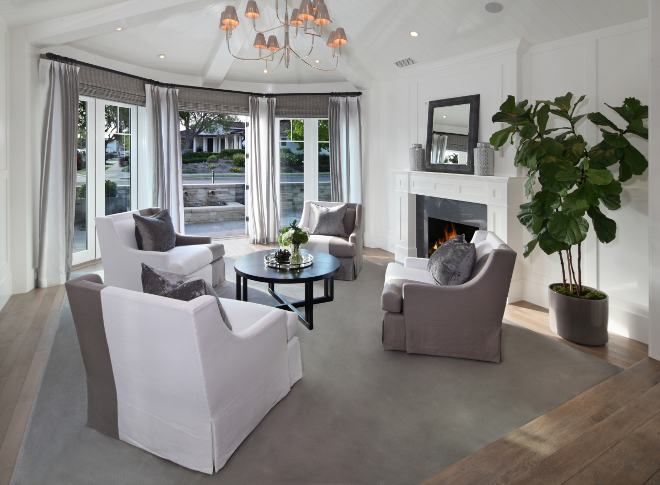 Living room chairs. Living room chairs. Living room with round seating. Lighting is from Circa Lighting. French doors open to the front porch. #Livingroom #chairs Brandon Architects, Inc