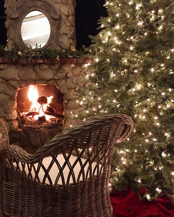 Patio Christmas Tree. Patio Christmas Tree by outdoor fireplace. Patio Christmas Tree #PatioChristmasTree French Country Cottage via Instagram @frenchcountrycottage