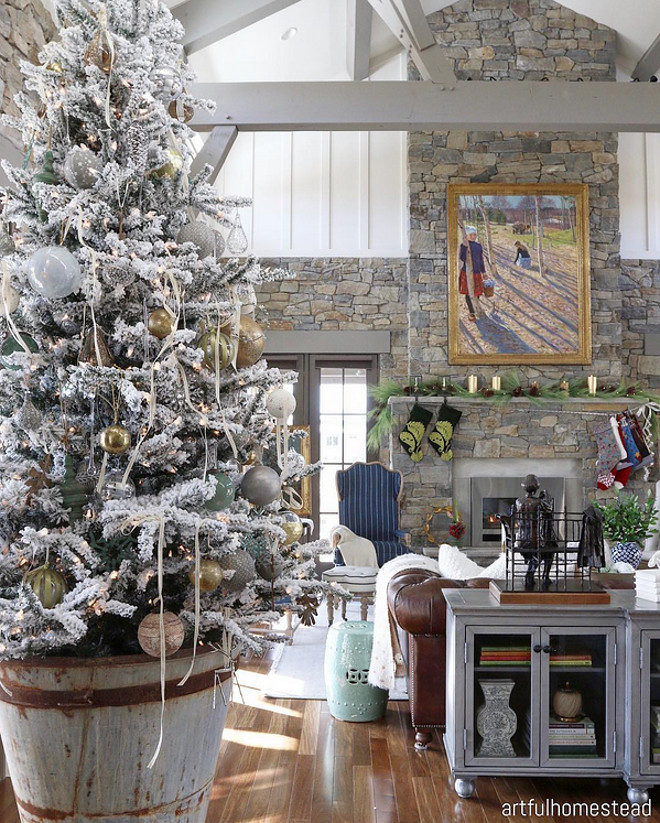 Rustic Christmas Tree. Gorgeous 9' flocked Christmas tree in a 3' rusty barrel. Decorated in silvers, golds, teardrops and ribbons. #RusticChristmasTree #RusticChristmas #ChristmasTree Hollie via Instagram @artfulhomestead