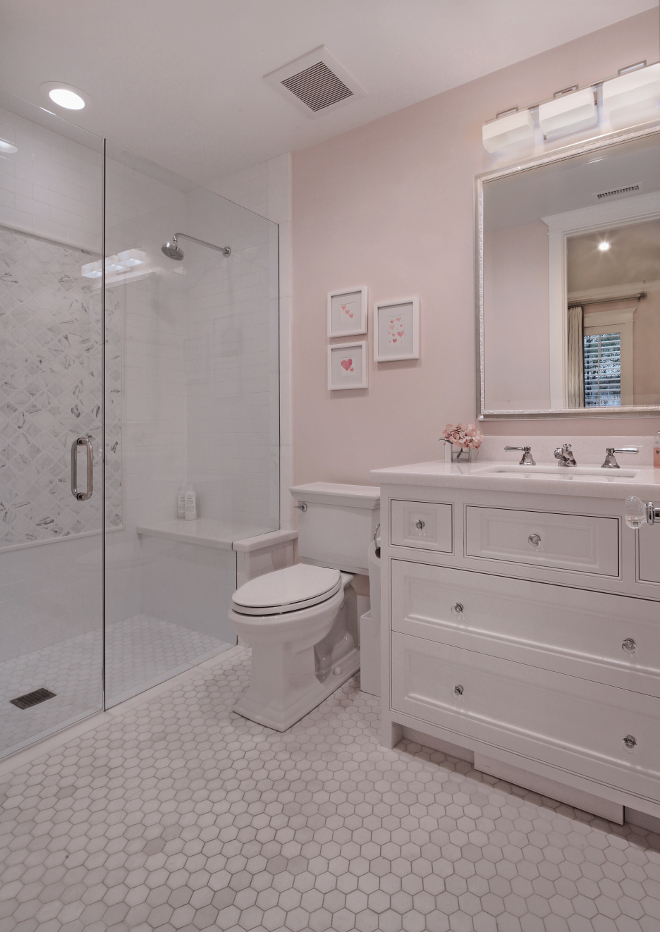 Small Bathroom. Hex floor tiles, white cabinet with glass knobs and pale pink walls create a timeless feel to this small bathroom. Small Bathroom. Small Bathroom #SmallBathroom Brandon Architects, Inc