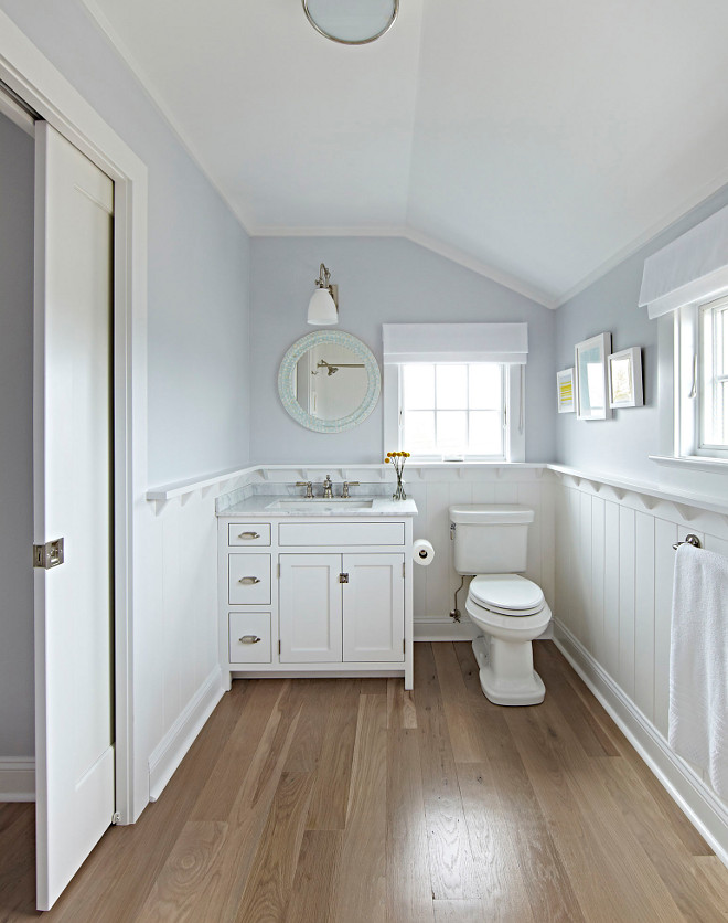 Bathroom Wood Floor and Wainscoting. The master bathroom features wide plank solid white oak hardwood floors. Bathroom Wood Floor and Wainscoting Ideas. Bathroom Wood Floor #Bathroom #WoodFloor #Wainscoting Chango & Co.