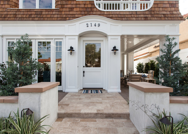 Coastal Home Front Door and Exterior Lighting. Coastal Home Front Door and Exterior Lighting ideas. Coastal Home Front Door and Exterior Lighting. The windows and doors are by Pella Windows. #CoastalHome #FrontDoor #ExteriorLighting Brandon Architects, Inc.