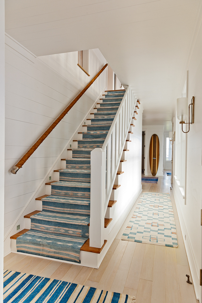 Coastal Staircase. Coastal Staircase with rope railing, blue and white runner and blue and white stair runner. Coastal Staircase #CoastalStaircase #Rope #RopeRailing #blueandwhiterunner #runner #stairrunner Beau Clowney Architects. Jenny Keenan Design