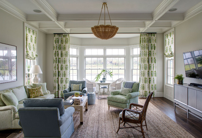 Family room. Grey walls family room with sisal rug and beautiful draperies and Roman shades. #Familyroom Andrew Howard Interior Design