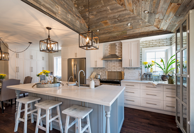 Farmhouse Kitchen. Joanna Gaines style Rustic farmhouse kitchen. Joanna Gaines inspired Farmhouse kitchen with shiplap. The new farmhouse kitchen features reclaimed barn wood ceilings, shaker-style cabinetry and exposed brick backsplash. The perimeter cabinets are painted in Benjamin Moore White Dove. Farmhouse kitchen with barn wood shiplap ceiling and whitewashed brick backsplash #FarmhouseKitchen #Rusticfarmhousekitchen #Farmhouse #kitchen #barnwoodshiplap #barnwoodshiplapceiling #whitewashedbrick #whitewashedbrickbacksplash #joannagaines #joannagaineskitchen #joannagainesfarmhousekitchen #joannagainesstylekitchen Hardcore Renos