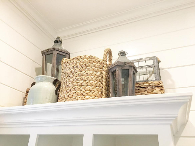 Farmhouse Decor. Accessories to bring a relaxed farmhouse look to your home. The lanterns, wicker baskets, and light blue jug are from Pottery Barn. #Farmhousedecor 