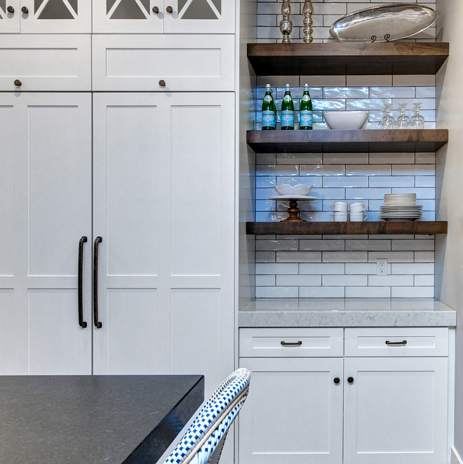 Kitchen combination of cabinets and open wood shelves. The thick wood open shelves feature subway tile backsplash with dark grey grout. #Kitchen #cabinetsandopenshelves #woodshelves #thickwoodshelves #openshelves #subwaytile #backsplash Timberidge Custom Homes