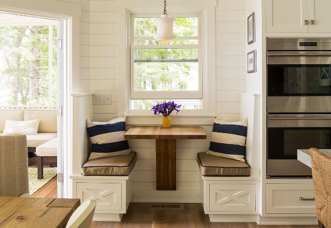 Kitchen nook for two. Cozy nook beside dining area. This cozy kitchen nook is perfect for a quiet coffee time with the paper or tablet. #Cozynook #Kitchennook Sharratt Design & Company