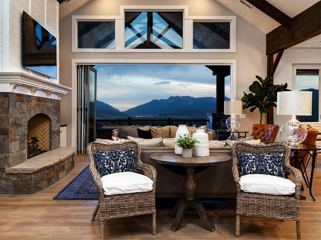 Living room Accordion Door. Living room Accordion Doors. Living room Accordion Doors and Transon Windows. Accordion patio doors allow the indoors to feel completely connected with the outdoors. #Livingroom #AccordionWindows #TransonWindows Timberidge Custom Homes