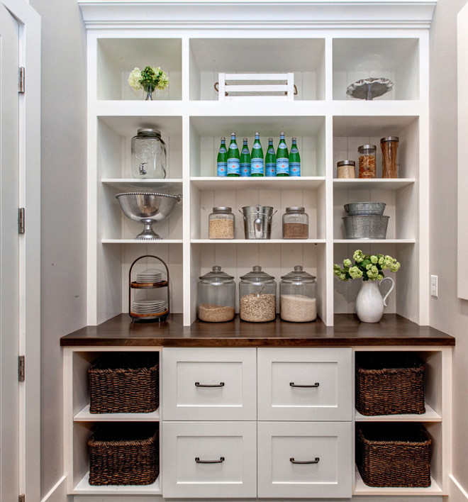 Pantry Built in Cabinet. Kitchen pantry with built in cabinet with open cubbies, butchers block countertop and wicker baskets. #Pantry #PantryBuiltinCabinet #Kitchenpantry #pantrycubbies #butchersblock #butchersblockcountertop #wickerbaskets Timberidge Custom Homes