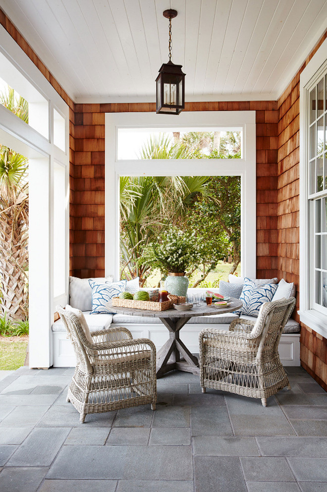 Porch. The porch features a gray stone flooring, a custom banquette and one of my favorites outdoor furniture - Kingsley-Bate. Andrew Howard Interior Design