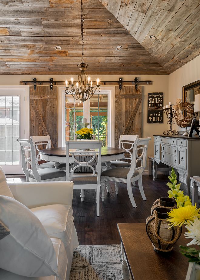 Rustic dining room with reclaimed wood ceiling. The barn board was purchased from a rep supplier up north and its as is. No planing or finishing, that's how they came and got installed. Rustic dining room with reclaimed wood ceiling and rustic reclaimed wood barn door. Hardcore Renos