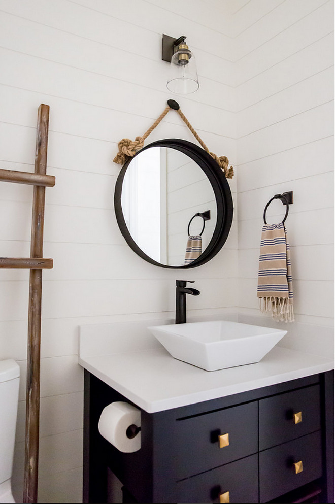 Shiplap Bathroom with navy vanity. Shiplap Bathroom with navy vanity and brass hardware. Shiplap Bathroom with navy vanity #ShiplapBathroom #navyvanity #Brasshardware Timberidge Custom Homes