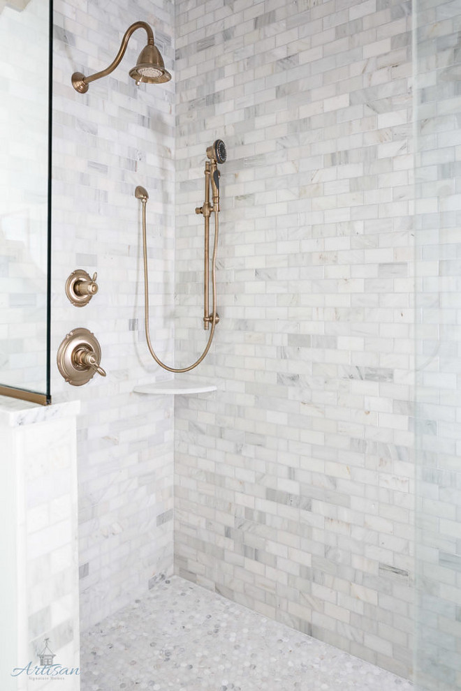 Shower Tile Combination: Marble subway tile on walls and marble penny tile on the floor. #ShowerTileCombination #Marblesubwaytile #walltile #marblepennytile #pennytile Artisan Signature Homes. Interiors by Gretchen Black