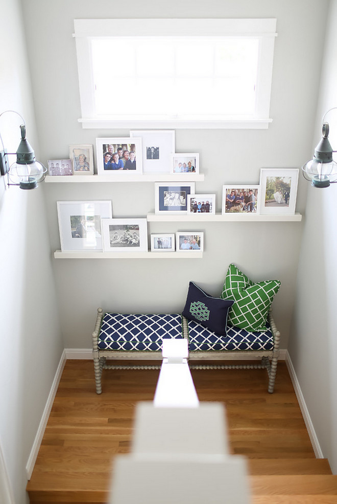 Staircase with bench and photo gallery. Easy and affordable way to decorate that empty space on your stairway. Add a stylish bench and framed photos on Ikea wall shelves. #Staircase #Staircasebench #photogallery #Staircasephotogallery #decorate AGK Design Studio. Ryan Garvin Photography.