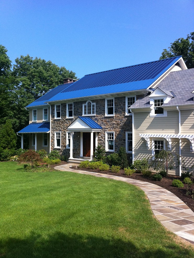 This ocean blue metal roof features a 5 kw solar thin film system that laminates directly to the standing seam panels. By Global Home Improvement.