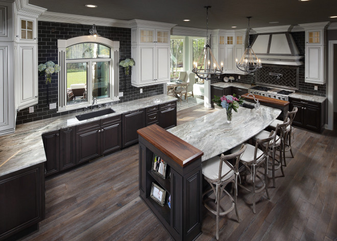 Two toned Farmhouse kitchen. Two toned Farmhouse kitchen with stacked wall cabinets, quartzite countertop, industrial rope lighting and dark grey subway tile. #Twotonedkitchen #Farmhous kitchen #TwotonedFarmhousekitchen #kitchenstackedwallcabinets #stackedwallcabinets #quartzitecountertop #industriallighting #ropelighting #darkgreysubwaytile #greysubwaytile #subwaytile Barrington Homes Inc.