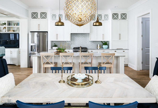 White kitchen with brass lighting and navy accessories. Beautiful White kitchen with brass lighting and navy accessories #Whitekitchen #brasslighting #navyaccessories