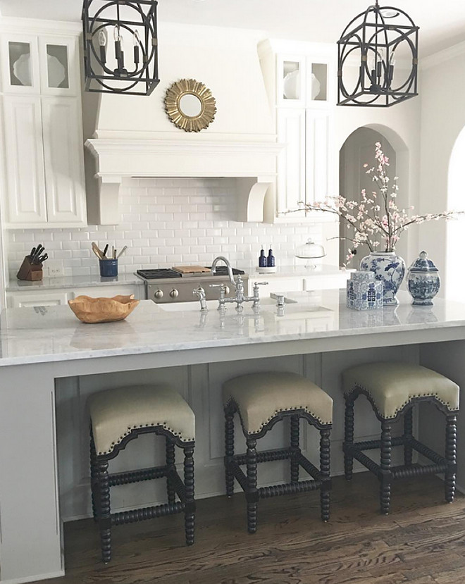 White kitchen with grey island and marble countertop. The grey island ties perfectly with the white cabinets. White kitchen with grey island and marble countertop ideas #Whitekitchen #greyisland #marblecountertop Beautiful Homes of Instagram: classicstylehome