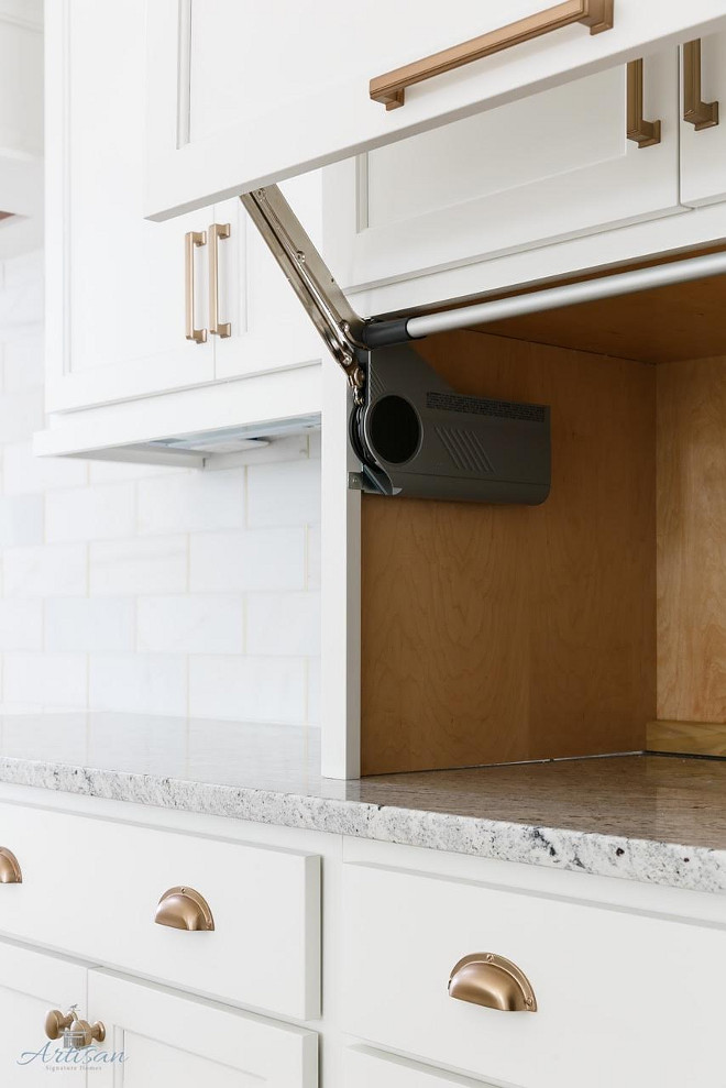 Appliance Garage. We like to hide the coffee maker, toasters and microwave when we can and have utilized these cool countertop cabinets #Appliancegarage
