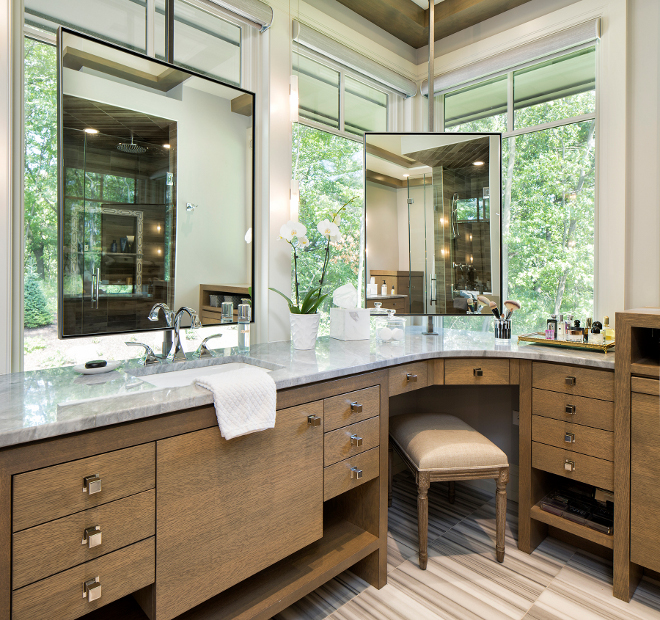Corner Vanity Cabinet, Bathroom with corner vanity and mirror in front of window, These are all custom mirrors and mounting brackets #bathroom #cornervanity #cornercabinet #mirror #mirrorbracket Hendel Homes