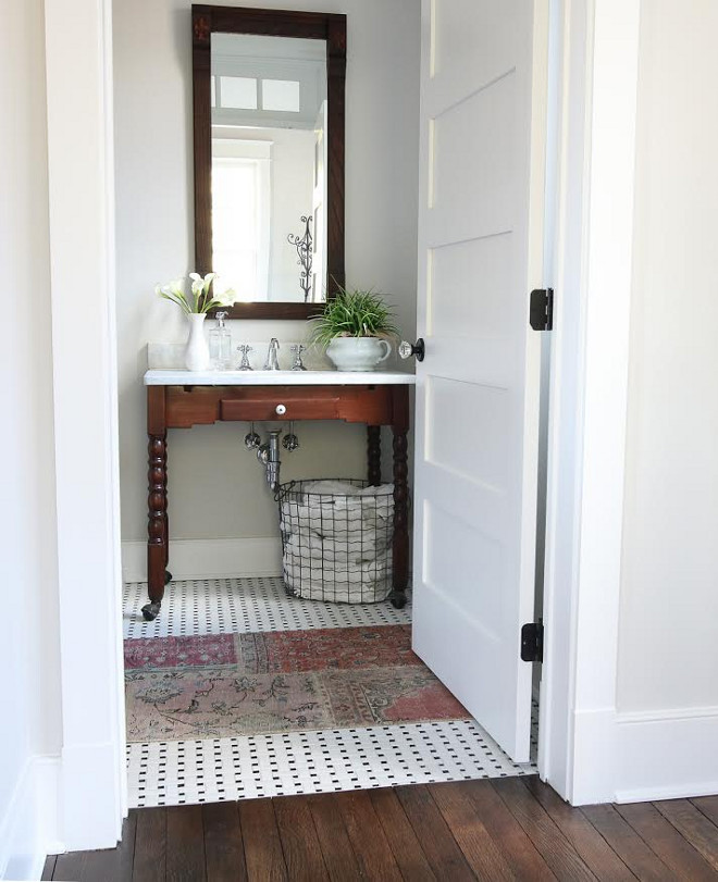 Farmhouse bathroom with repurposed an antique kitchen table and made it into a vanity and vintage runner. #farmhousebathroom #bathroom Beautiful Homes of Instagram @greensprucedesigns