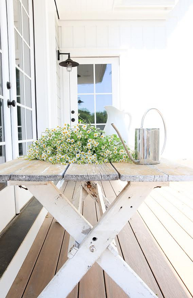 Farmhouse porch with Distressed salvaged trestle table. Farmhouse porch with Distressed salvaged trestle table. Great way to decorate a farmhouse porch #Farmhouseporch #Distressedsalvagedtrestletable Beautiful Homes of Instagram @greensprucedesigns