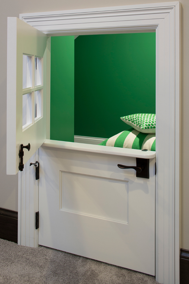 Grassy Fields 2034-30 Benjamin Moore, The lower level kids' play space under the stairs feature a custom dutch door, The green walls are painted in Grassy Fields 2034-30 Benjamin Moore Grassy Fields 2034-30 Benjamin Moore Paint Color, Grassy Fields 2034-30 Benjamin Moore #GrassyFields203430BenjaminMoore GrassyFieldsBenjaminMoore Grace Hill Design