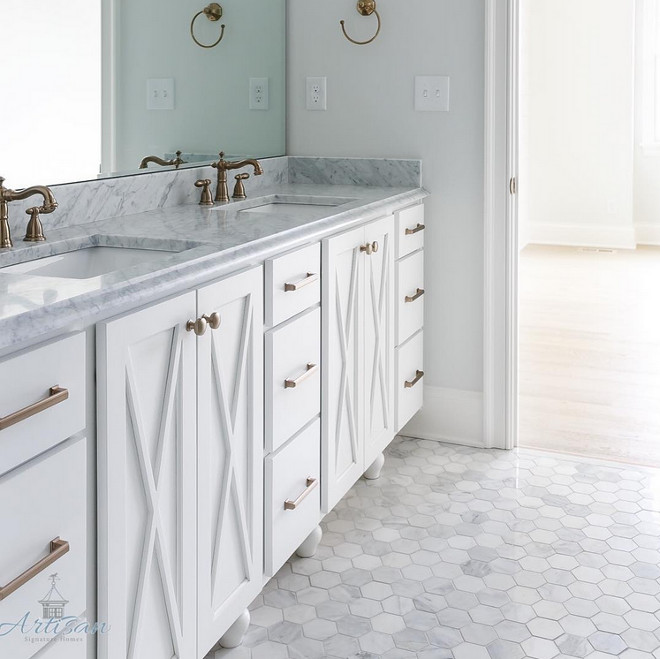 Hex Carrara marble tile on the floor. Master bathroom with white cabinet, brass and hex Carrara marble tile on the floor. #hexCarraramarbletile #hexCarraratile #bathroomfloor Built by Artisan Signature Homes. Interior Design by Gretchen Black from Greyhouse Design