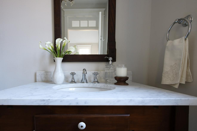 I repurposed an antique kitchen table and made it into a vanity, with a custom honed marble countertop. Beautiful Homes of Instagram @greensprucedesigns
