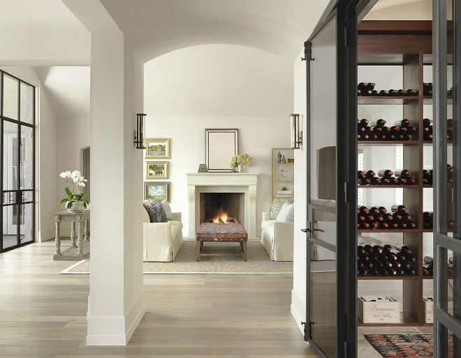 Living room with walk in wine cellar with black steel doors. Living room with walk in wine cellar with black steel doors. #Livingroom #walkinwinecellar #winecellar #blacksteeldoors #winecellarblacksteeldoor.